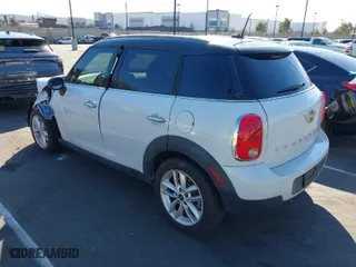 2014 MINI Cooper Countryman with VIN WMWZB3C53EWR39767, listed as a IAAI auction lot 41592112 with 129,403 mi miles. Bid and sale history available at carsss.com. Image 3.