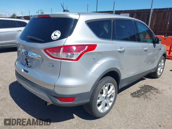 2013 Ford Escape SEL with VIN 1FMCU9HX0DUD42081, listed as a IAAI auction lot 42293456 with 100,013 mi miles and . Bid and sale history available at DreamBid. Image 4.