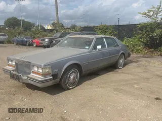 1982 Cadillac Seville z VIN 1G6AS6989CE694210, wystawiony jako Copart lot #74978254 z przebiegiem 21 412 mil mil oraz Tytuł czysty. Historia ofert i sprzedaży dostępna na DreamBid. Obrazek 2.