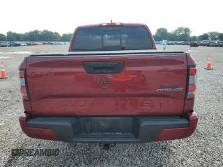 2022 Nissan Frontier Pro-4X with VIN 1N6ED1EK1NN601886, listed as a Copart auction lot 65182295 with 51,879 mi miles and Salvage title. Bid and sale history available at DreamBid. Image 6.