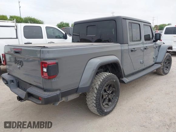 2022 Jeep Gladiator Willys with VIN 1C6JJTAMXNL137237, listed as a IAAI auction lot 41947651 with 55,199 mi miles and . Bid and sale history available at DreamBid. Image 4.