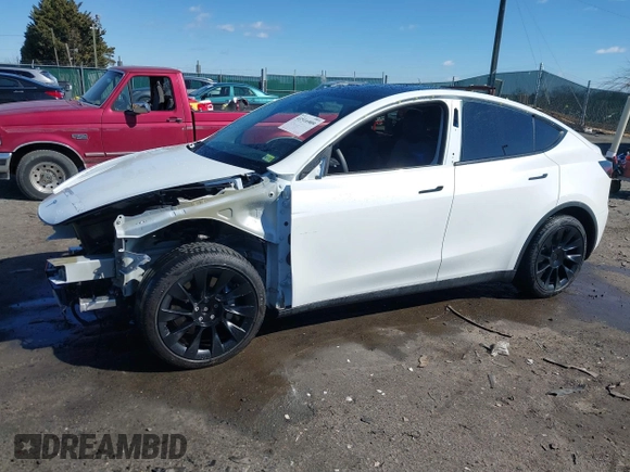 2021 Tesla Model Y Long Range with VIN 5YJYGAEE6MF196610, listed as a IAAI auction lot 41516909 with 30,431 mi miles. Bid and sale history available at carsss.com. Image 15.