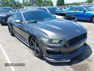 2015 Ford Mustang EcoBoost z VIN 1FA6P8TH5F5351476, wystawiony jako IAAI lot #42157688 z przebiegiem 134 131 mil mil oraz . Historia ofert i sprzedaży dostępna na DreamBid. Obrazek 1.