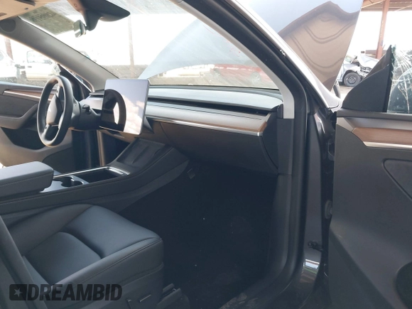 2023 Tesla Model Y Long Range with VIN 7SAYGDEE4PF875915, listed as a IAAI auction lot 42095178 with 11,928 mi miles and . Bid and sale history available at DreamBid. Image 5.