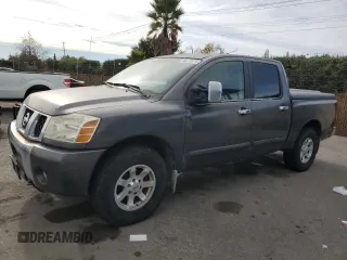 2005 Nissan Titan SE with VIN 1N6AA07B65N566082, listed as a Copart auction lot 80879174 with 215,297 mi miles and Clean Title. Bid and sale history available at carsss.com. Image 1.