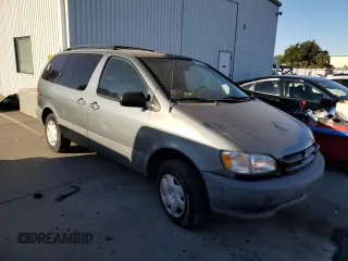 1999 Toyota Sienna CE with VIN 4T3ZF19C2XU100132, listed as a Copart auction lot 75251124 with 217,399 mi miles and Salvage Title. Bid and sale history available at carsss.com. Image 4.