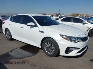 2019 Kia Optima LX z VIN 5XXGT4L30KG306460, wystawiony jako IAAI lot #42620073 z przebiegiem 66 966 mil mil oraz . Historia ofert i sprzedaży dostępna na DreamBid. Obrazek 1.