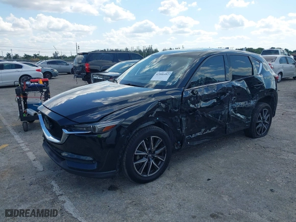 2018 Mazda CX-5 Grand Touring with VIN JM3KFBDM2J0390611, listed as a IAAI auction lot 42006482 with 97,497 mi miles. Bid and sale history available at carsss.com. Image 17.