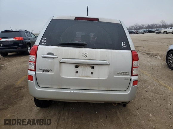 2012 Suzuki Grand Vitara Premium z VIN JS3TD0D66C4100621, wystawiony jako Copart lot #86968164 z przebiegiem Nie podano mil oraz Szkody całkowita. Historia ofert i sprzedaży dostępna na DreamBid. Obrazek 6.