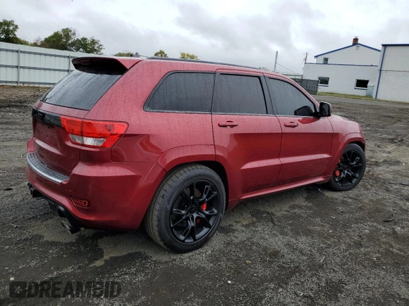 2012 Jeep Grand Cherokee SRT8 with VIN 1C4RJFDJ0CC351195, listed as a Copart auction lot 72794454 with 104,672 mi miles and Salvage Title. Bid and sale history available at carsss.com. Image 3.