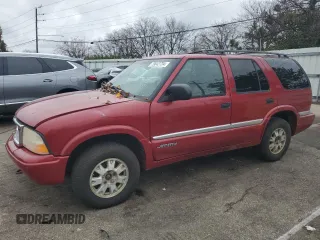 1999 GMC Jimmy SLE with VIN 1GKDT13W3X2546163, listed as a Copart auction lot 79842734 with 144,800 mi miles and Salvage Title. Bid and sale history available at carsss.com. Image 1.