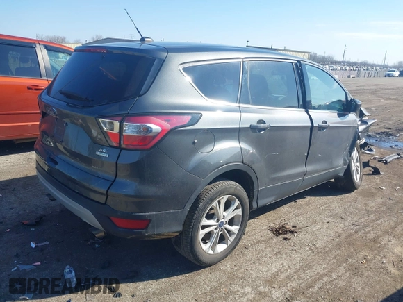 2017 Ford Escape SE with VIN 1FMCU0GD0HUB80123, listed as a IAAI auction lot 41895514 with 61,680 mi miles and . Bid and sale history available at DreamBid. Image 4.
