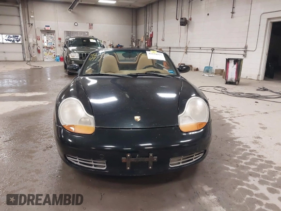 1999 Porsche Boxster z VIN WP0CA2984XU622814, wystawiony jako IAAI lot #42234977 z przebiegiem 52 404 mil mil oraz . Historia ofert i sprzedaży dostępna na DreamBid. Obrazek 13.
