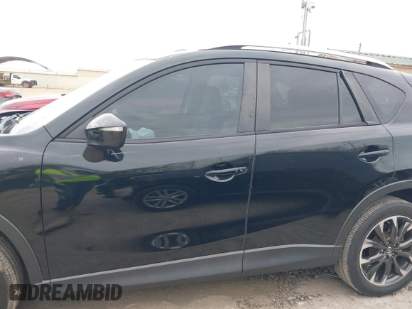 2016 Mazda CX-5 Grand Touring with VIN JM3KE2DY0G0651300, listed as a IAAI auction lot 41678833 with 98,790 mi miles. Bid and sale history available at carsss.com. Image 14.