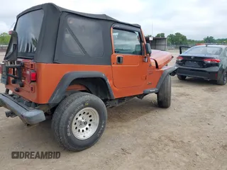2001 Jeep Wrangler Sport z VIN 1J4FA49S01P341940, wystawiony jako IAAI lot #42542715 z przebiegiem 87 651 mil mil oraz . Historia ofert i sprzedaży dostępna na DreamBid. Obrazek 4.