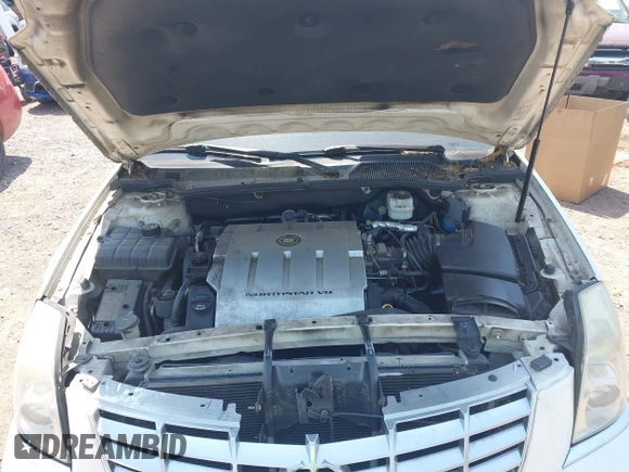 2006 Cadillac DTS w/1SC with VIN 1G6KD57Y36U116528, listed as a IAAI auction lot 42063595 with 128,839 mi miles. Bid and sale history available at carsss.com. Image 10.