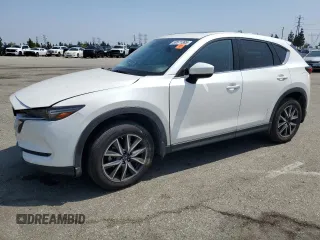 2018 Mazda CX-5 Grand Touring z VIN JM3KFADM3J1464073, wystawiony jako Copart lot #59571385 z przebiegiem Nie podano mil oraz Szkoda całkowita • Salvage title. Historia ofert i sprzedaży dostępna na DreamBid. Obrazek 1.