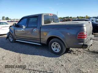 2002 Ford F-150 Harley Davidson with VIN 1FTRW07362KC77880, listed as a Copart auction lot 75259594 with 103,591 mi miles and Salvage Title. Bid and sale history available at carsss.com. Image 2.