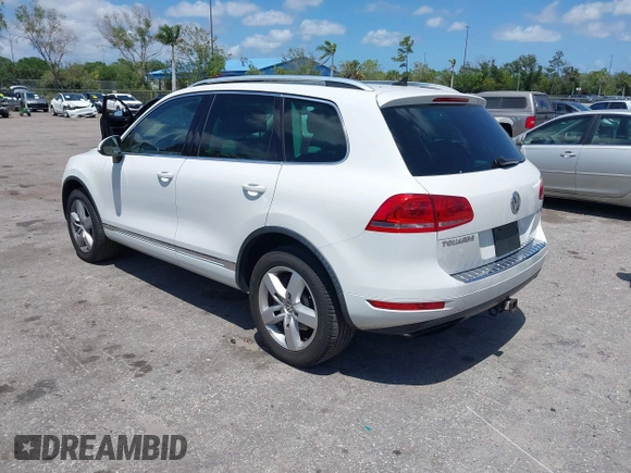 2012 Volkswagen Touareg Sport with VIN WVGEF9BP1CD008717, listed as a IAAI auction lot 42120641 with 211,580 mi miles and . Bid and sale history available at DreamBid. Image 3.