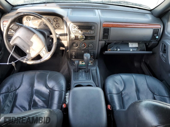 1999 Jeep Grand Cherokee Laredo z VIN 1J4GW58N1XC737706, wystawiony jako Copart lot #83107914 z przebiegiem Nie podano mil oraz Szkoda całkowita • Salvage title. Historia ofert i sprzedaży dostępna na DreamBid. Obrazek 8.