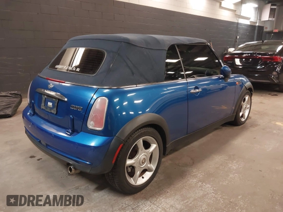 2005 MINI Convertible with VIN WMWRF33555TF63632, listed as a IAAI auction lot 42166640 with 102,559 mi miles and . Bid and sale history available at DreamBid. Image 4.