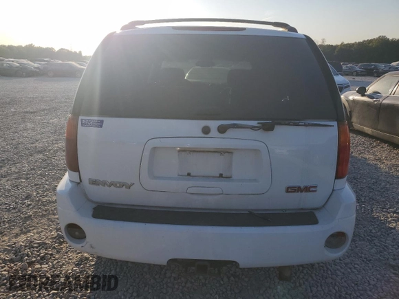 2004 GMC Envoy SLE with VIN 1GKDS13S542233286, listed as a Copart auction lot 76129164 with 228,981 mi miles and Salvage Title. Bid and sale history available at DreamBid. Image 6.