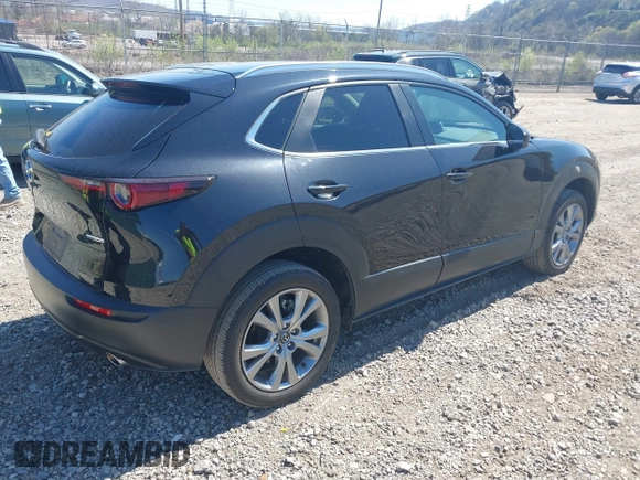 2023 Mazda CX-30 S Carbon Edition with VIN 3MVDMBCM1PM509987, listed as a IAAI auction lot 42060833 with 14,140 mi miles and . Bid and sale history available at DreamBid. Image 4.