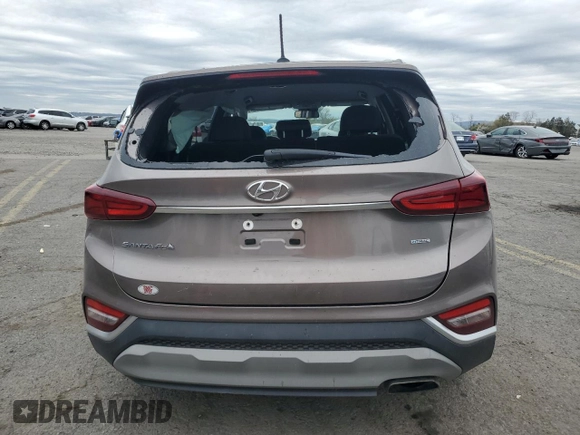 2019 Hyundai Santa Fe SE z VIN 5NMS2CAD0KH123337, wystawiony jako Copart lot #53883405 z przebiegiem 79 456 mil mil oraz Szkoda całkowita • Salvage title. Historia ofert i sprzedaży dostępna na DreamBid. Obrazek 6.