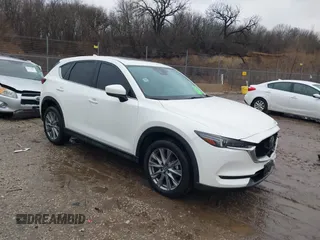 2021 Mazda CX-5 Grand Touring with VIN JM3KFADM4M1340141, listed as a IAAI auction lot 41194711 with 37,887 mi miles. Bid and sale history available at carsss.com. Image 1.