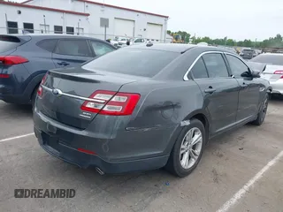 2015 Ford Taurus SEL with VIN 1FAHP2E81FG163058, listed as a IAAI auction lot 42221098 with 127,957 mi miles and . Bid and sale history available at carsss.com. Image 4.