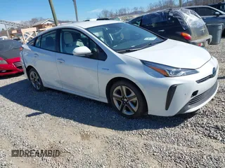 2021 Toyota Prius L Eco z VIN JTDKAMFUXM3142402, wystawiony jako IAAI lot #41665484 z przebiegiem 67 416 mil mil oraz . Historia ofert i sprzedaży dostępna na DreamBid. Obrazek 1.