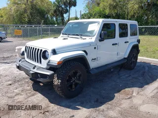 2020 Jeep Wrangler Unlimited Sahara with VIN 1C4HJXEN4LW330867, listed as a IAAI auction lot 41790709 with 63,151 mi miles. Bid and sale history available at carsss.com. Image 17.