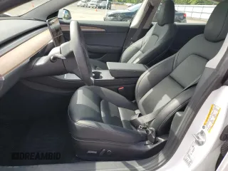 2023 Tesla Model 3 Long Range with VIN 5YJ3E1EB1PF603100, listed as a Copart auction lot 54945865 with 22,865 mi miles and Salvage Title. Bid and sale history available at DreamBid. Image 7.