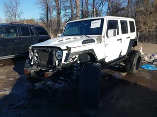 2014 Jeep Wrangler Unlimited Sahara with VIN 1C4HJWEG2EL273813, listed as a IAAI auction lot 41311011 with 96,104 mi miles. Bid and sale history available at carsss.com. Image 17.