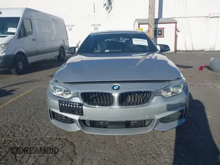 2015 BMW 4 Series 428i with VIN WBA4A5C58FG051293, listed as a IAAI auction lot 41255541 with 60,737 mi miles and . Bid and sale history available at DreamBid. Image 13.