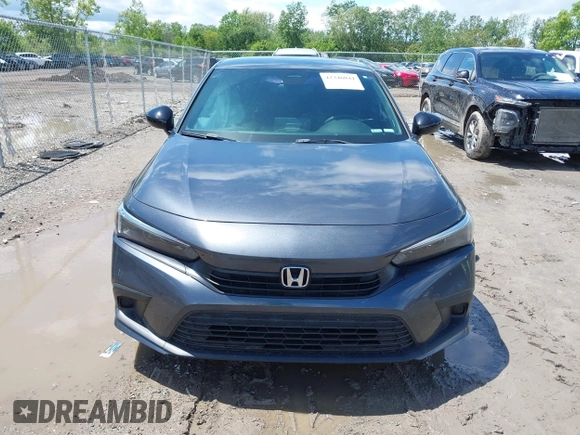 2022 Honda Civic Sport z VIN 2HGFE2F58NH560511, wystawiony jako IAAI lot #42346044 z przebiegiem 51 357 mil mil oraz . Historia ofert i sprzedaży dostępna na DreamBid. Obrazek 13.