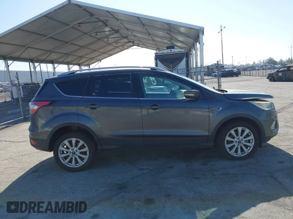 2018 Ford Escape Titanium with VIN 1FMCU0J98JUA03474, listed as a IAAI auction lot 37677880 with 106,423 mi miles and . Bid and sale history available at DreamBid. Image 13.