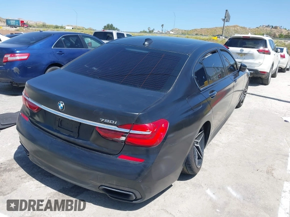 2018 BMW 7 Series 750i with VIN WBA7F0C51JGM23504, listed as a IAAI auction lot 39379378 with 82,251 mi miles. Bid and sale history available at carsss.com. Image 4.
