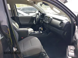 2022 Toyota Tacoma SR with VIN 3TYCZ5AN0NT074683, listed as a IAAI auction lot 42117875 with 51,112 mi miles and . Bid and sale history available at DreamBid. Image 5.