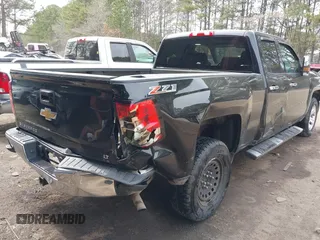 2014 Chevrolet Silverado 1500 LT with VIN 1GCVKREC4EZ110415, listed as a IAAI auction lot 41711383 with 100,344 mi miles and . Bid and sale history available at DreamBid. Image 6.
