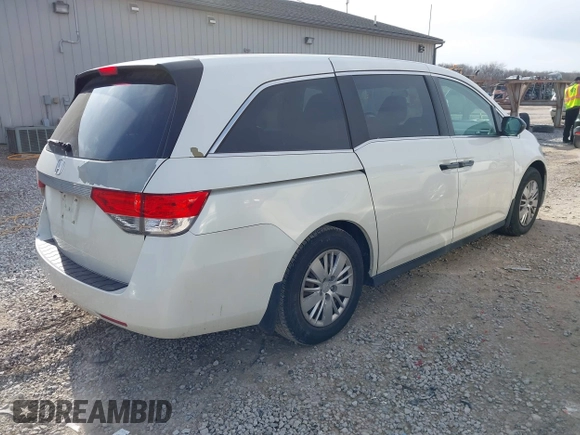 2014 Honda Odyssey LX with VIN 5FNRL5H24EB001551, listed as a IAAI auction lot 41879040 with 119,200 mi miles and . Bid and sale history available at DreamBid. Image 4.