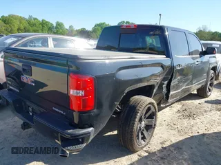 2015 GMC Sierra 1500 Denali with VIN 3GTU2WEJ9FG295202, listed as a IAAI auction lot 42046744 with 134,120 mi miles and . Bid and sale history available at DreamBid. Image 4.