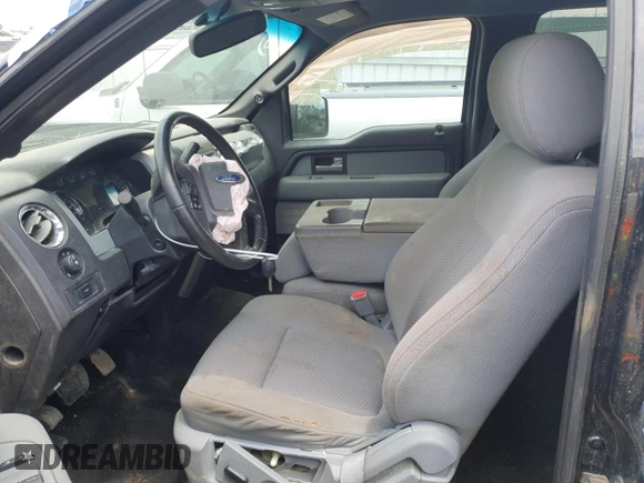 2013 Ford F-150 XL with VIN 1FTFW1EF8DFA21791, listed as a Copart auction lot 61963215 with 128,161 mi miles and Salvage title. Bid and sale history available at DreamBid. Image 7.