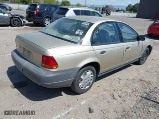 1996 Saturn SL with VIN 1G8ZH5288TZ230864, listed as a IAAI auction lot 42116703 with 104,387 mi miles. Bid and sale history available at carsss.com. Image 4.