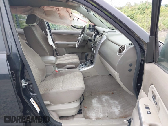 2012 Suzuki Grand Vitara Premium z VIN JS3TD0D6XC4100539, wystawiony jako IAAI lot #42384659 z przebiegiem 143 711 mil mil oraz . Historia ofert i sprzedaży dostępna na DreamBid. Obrazek 5.