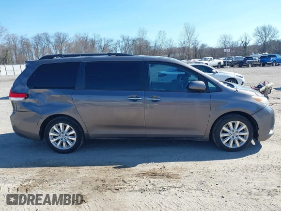 2012 Toyota Sienna XLE with VIN 5TDDK3DC5CS047530, listed as a IAAI auction lot 41780049 with 209,812 mi miles. Bid and sale history available at carsss.com. Image 14.