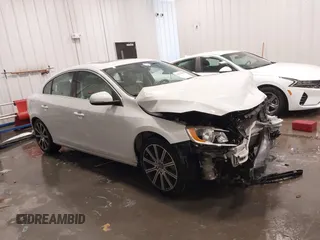 2016 Volvo S60 T5 Premier z VIN LYV612TK7GB096660, wystawiony jako IAAI lot #42234892 z przebiegiem 184 665 mil mil oraz . Historia ofert i sprzedaży dostępna na DreamBid. Obrazek 1.
