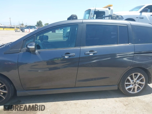 2014 Mazda 5 Grand Touring with VIN JM1CW2DL8E0171095, listed as a IAAI auction lot 41962650 with 85,048 mi miles and . Bid and sale history available at DreamBid. Image 14.