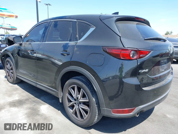 2018 Mazda CX-5 Grand Touring z VIN JM3KFADM7J0327272, wystawiony jako IAAI lot #42279536 z przebiegiem 97 478 mil mil oraz . Historia ofert i sprzedaży dostępna na DreamBid. Obrazek 3.