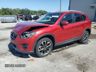2016 Mazda CX-5 Grand Touring z VIN JM3KE2DY1G0840473, wystawiony jako Copart lot #55223445 z przebiegiem 166 470 mil mil oraz Szkoda całkowita • Salvage title. Historia ofert i sprzedaży dostępna na DreamBid. Obrazek 1.
